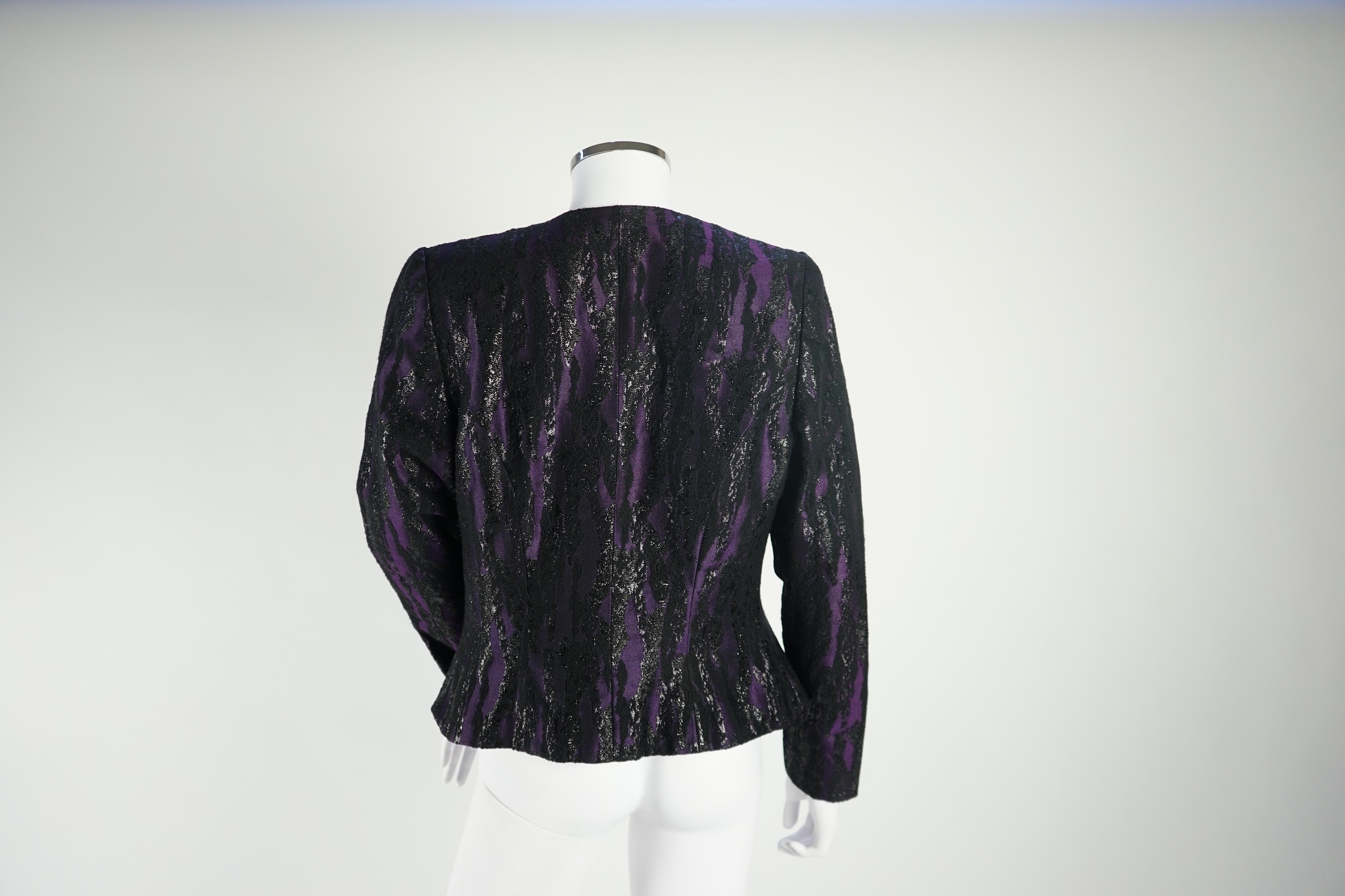 A lady's Boss (Hugo Boss) metallic purple and black evening jacket, three black skirts (Alexander McQueen, Emporio Armarni and Versace Classic) and a black sequin Ben de Lisi vest top, all approx. size 10